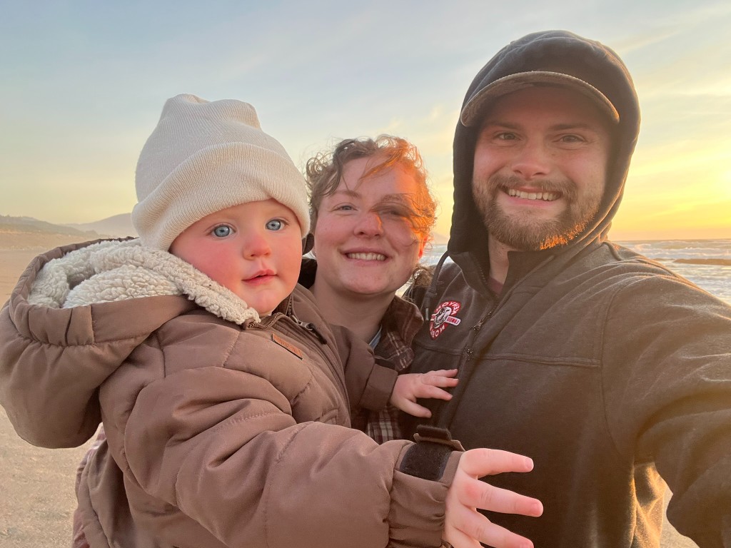Eli with his wife and child