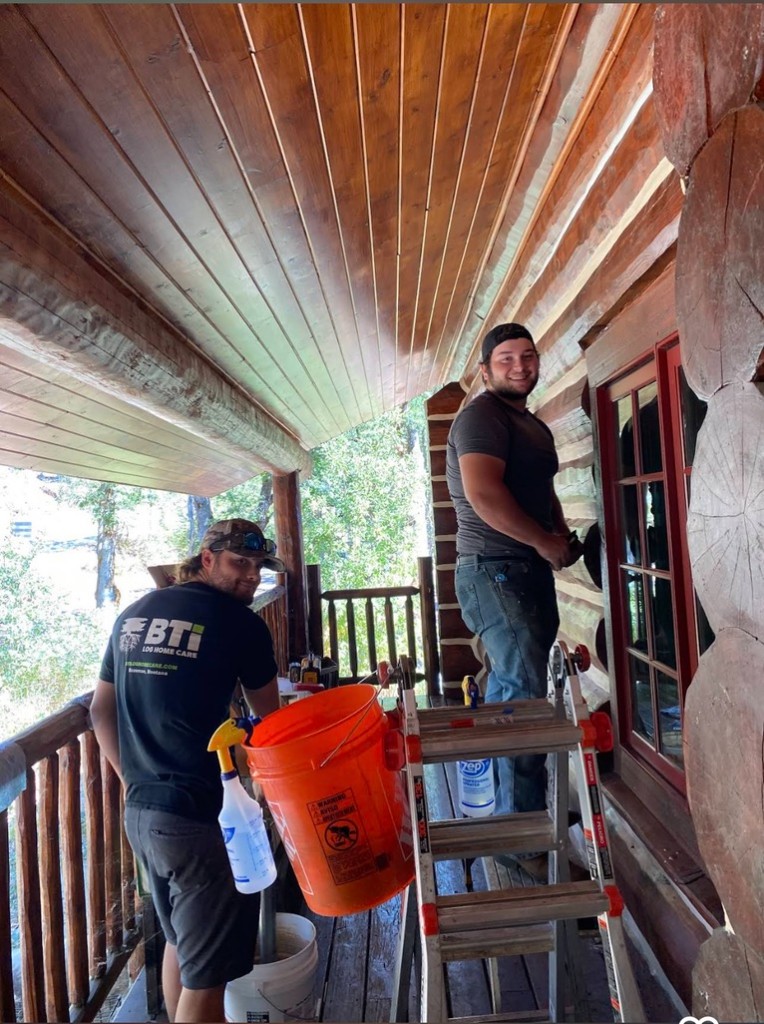 Pacific Home Renewals crew working on a log home porch